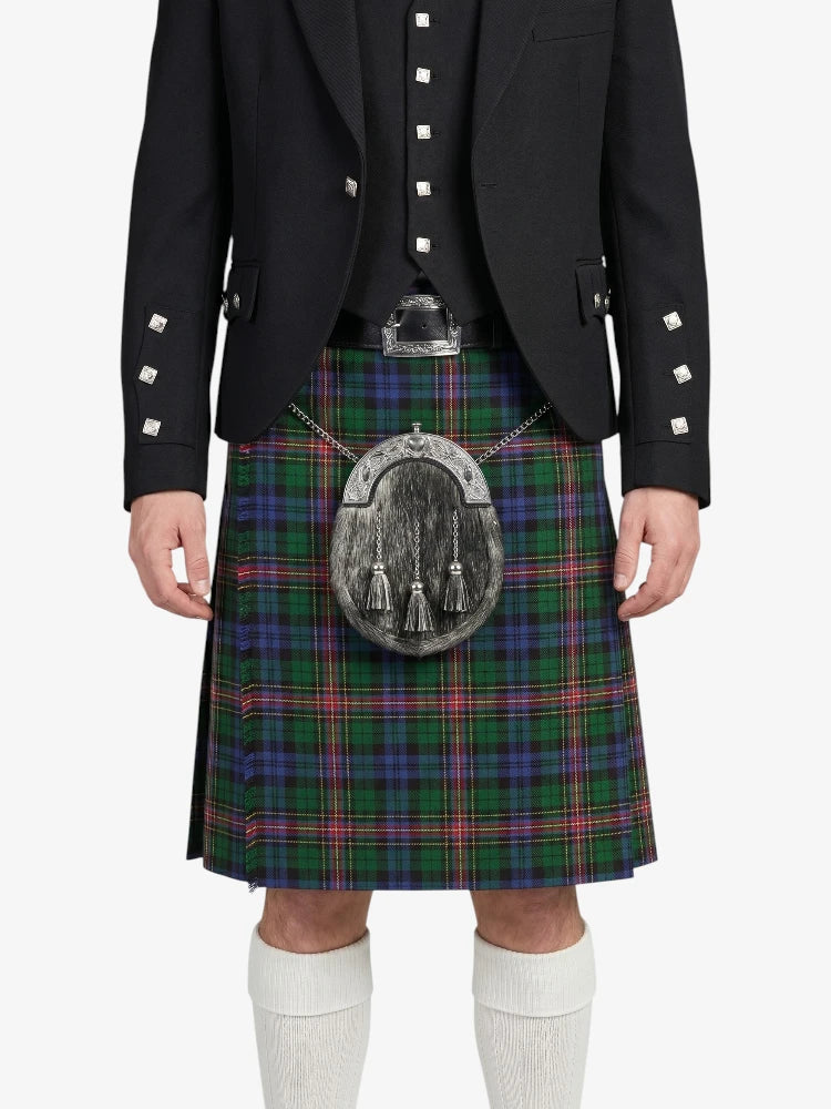 Person wearing a traditional Scottish kilt with a plaid pattern on a white background
