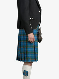 Person wearing a black jacket and blue plaid kilt on a white background