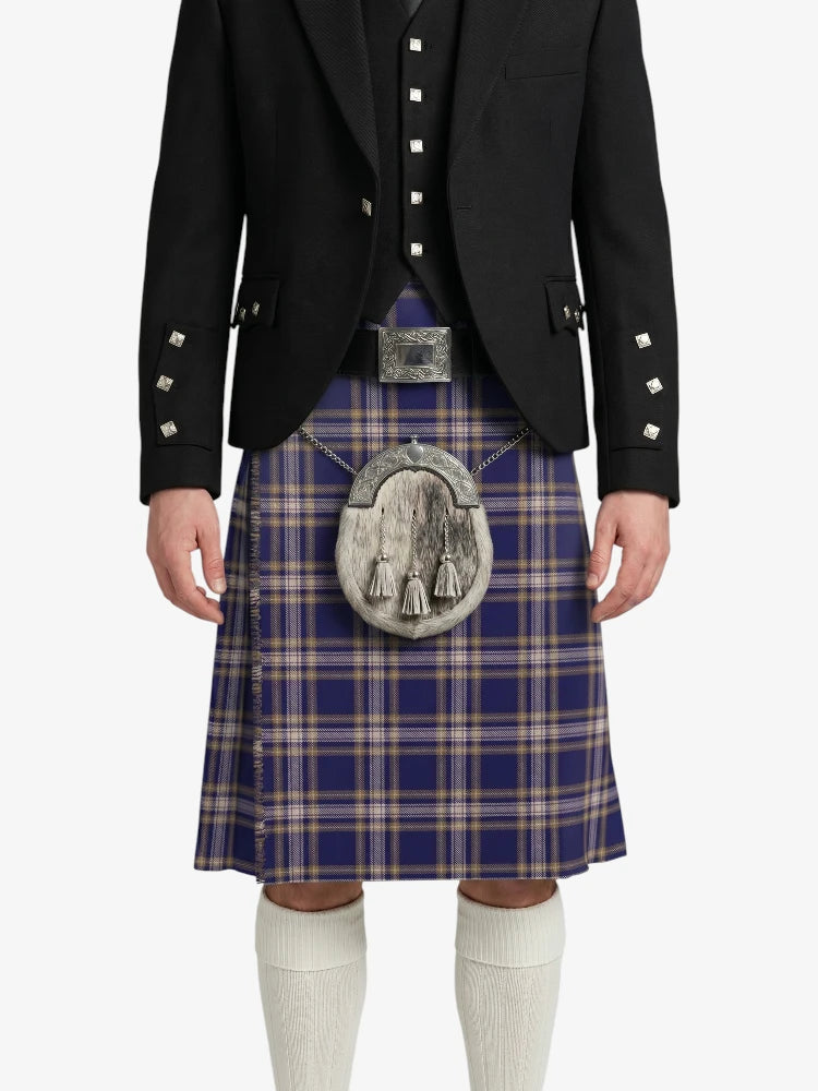 Person wearing a traditional Scottish kilt with a jacket on a white background
