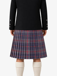 Person wearing a black jacket and plaid kilt on a white background