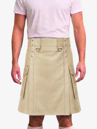 A beige faux-leather kilt with silver-tone hardware, worn by a model in a light pink t-shirt against a white background.