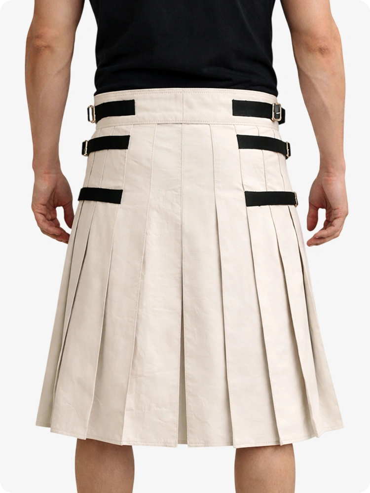 Beige kilt with black accents worn by a person on a white background