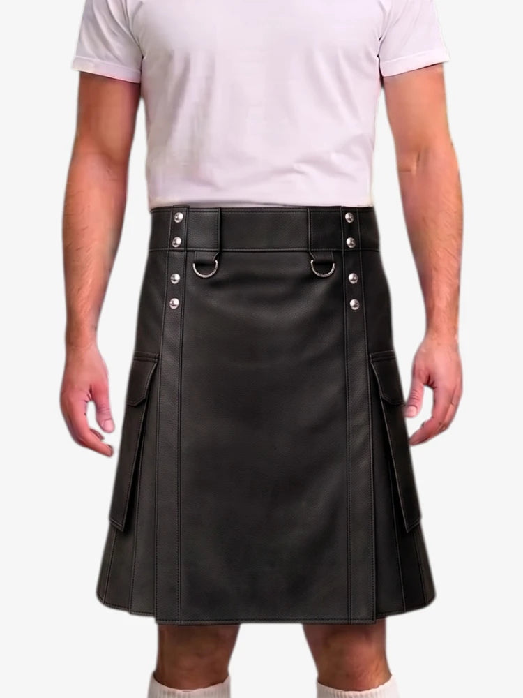 A black faux-leather kilt with silver-tone hardware, worn by a model in a white t-shirt against a light gray background.