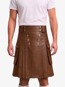 A brown faux-leather kilt with silver-tone double-breasted buttons and side flap pockets, shown on a model wearing a white t-shirt against a light gray background.