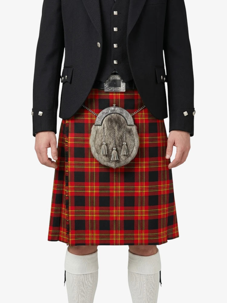 Person wearing a black jacket, red plaid kilt, and white socks on a white background
