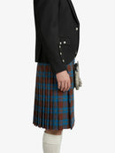 Person wearing a black jacket and plaid kilt on a white background