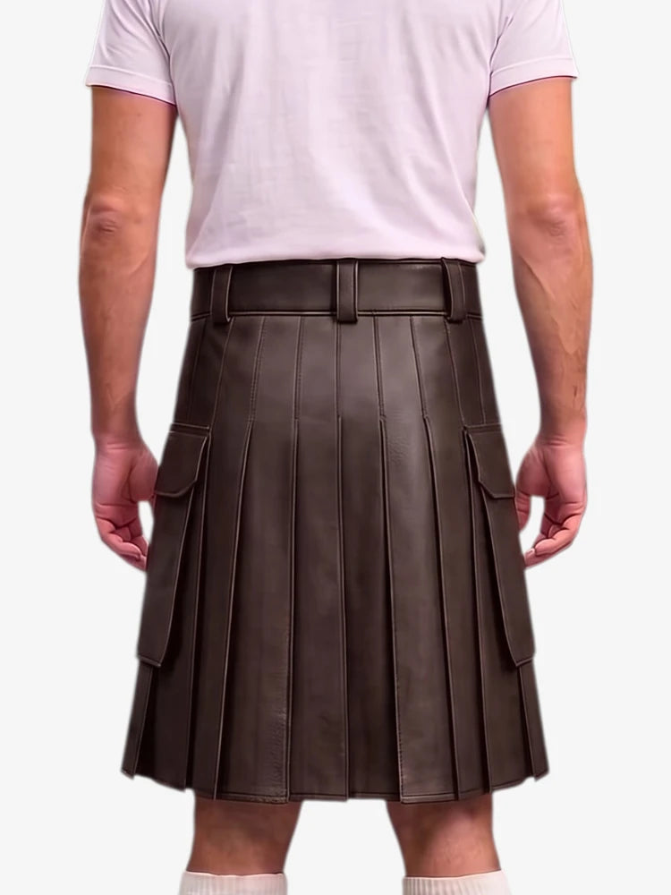 A person shown from the back wearing a dark brown pleated leather kilt with side cargo pockets, paired with a light pink t-shirt and white socks, against a plain light gray background.