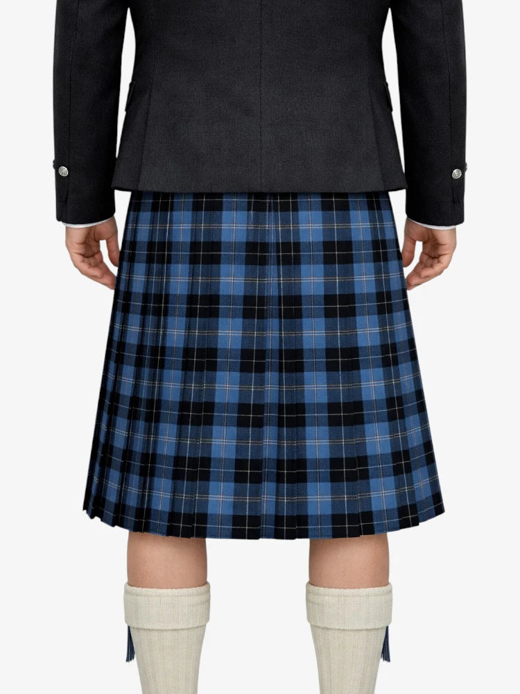 Person wearing a blue plaid kilt with a black jacket on a white background