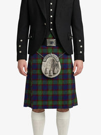 Person wearing a traditional Scottish kilt with a tartan pattern on a white background