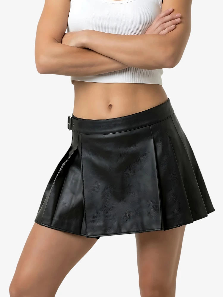 Person wearing a black leather skirt on a white background