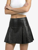 Black leather skirt worn by a person on a white background