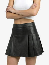 Black leather skirt worn by a person on a white background