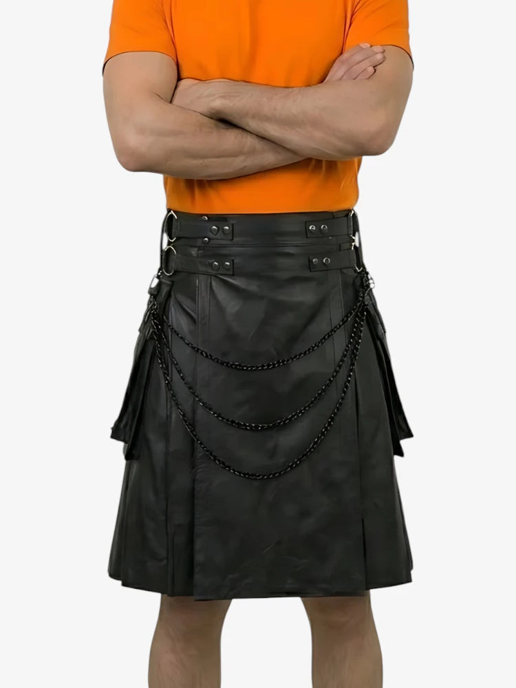 Person wearing a black leather kilt with decorative elements on a white background