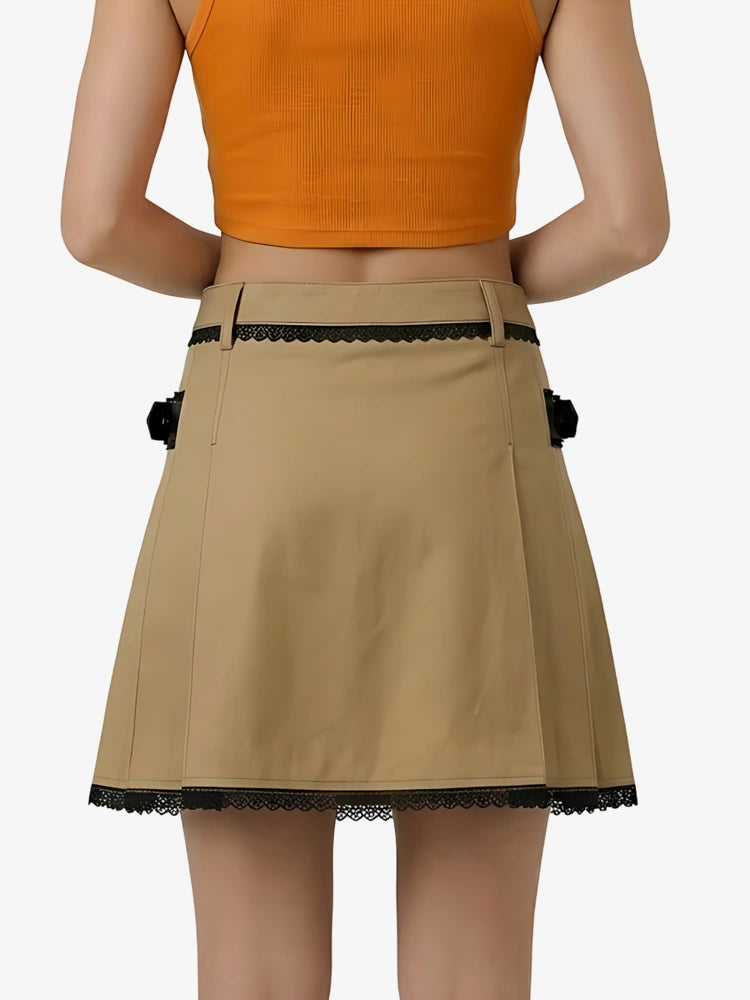 Beige skirt with black lace trim worn by a person on a white background
