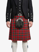 Person wearing a traditional Scottish kilt with a tartan pattern on a white background