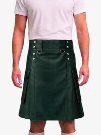 A dark green leather kilt with silver-tone metal hardware, worn by a model in a light pink t-shirt against a plain white background.