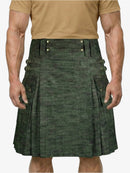Green kilt worn by a person on a white background