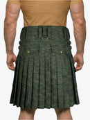 Green pleated kilt worn by a person on a white background