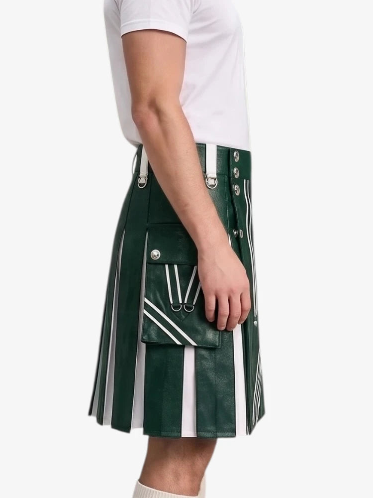 A side view of a person wearing a dark green pleated faux-leather kilt with white vertical stripes, white piping, and silver-tone metal hardware, paired with a white t-shirt.