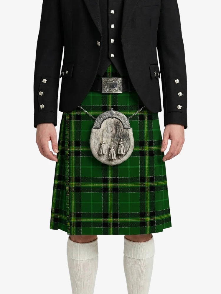 Person wearing a green tartan kilt with a black jacket on a white background