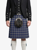 Person wearing a traditional Scottish kilt with a sporran on a white background