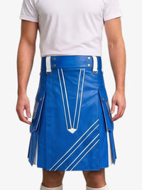 A man wearing a bright blue leather kilt with white contrast stitching and silver hardware, paired with a white t-shirt, shown from the chest down against a light gray background.