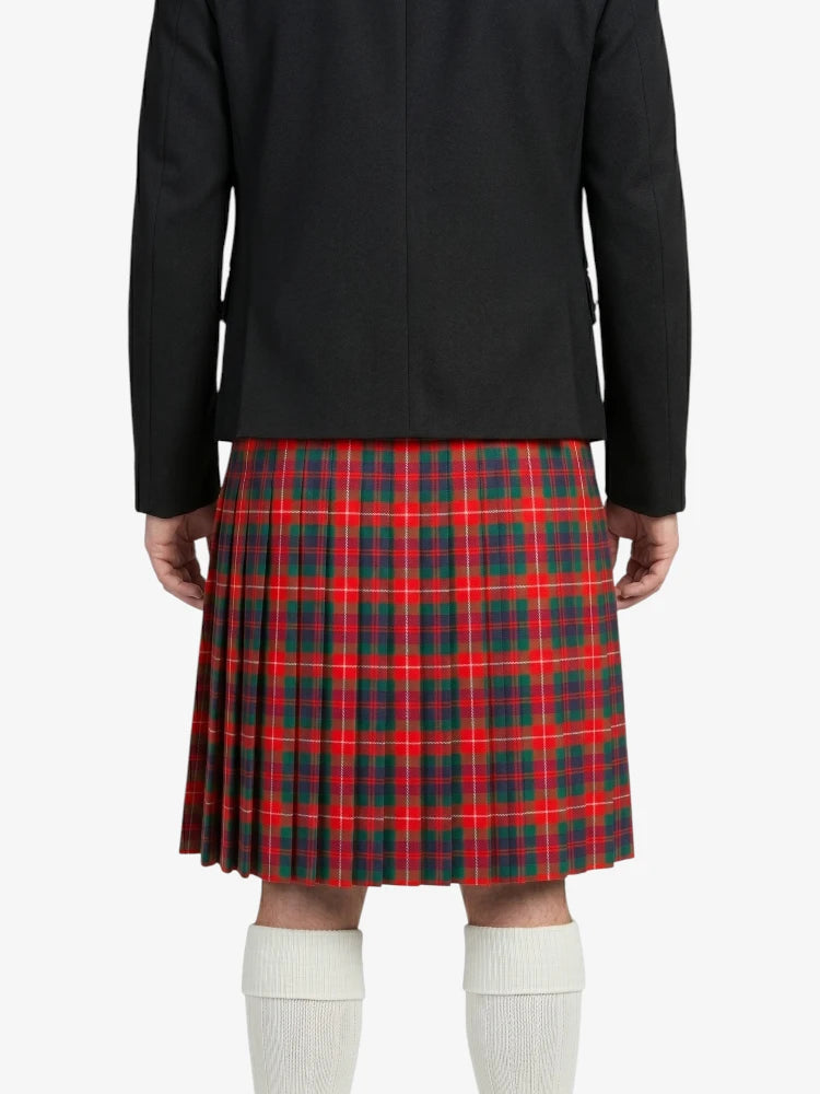 Person wearing a black jacket and red plaid skirt on a white background