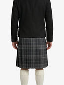 Person wearing a black jacket and plaid kilt on a white background
