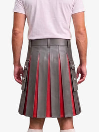 A gray pleated leather kilt with red inner panels and silver-tone decorative buttons, shown on a model from the back wearing a white t-shirt.