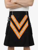 Black kilt with orange and gray chevron pattern worn by a person on a white background