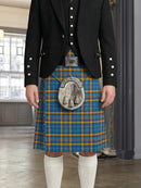 Person wearing a traditional Scottish kilt with a plaid pattern and a visible tartan emblem in an indoor setting.