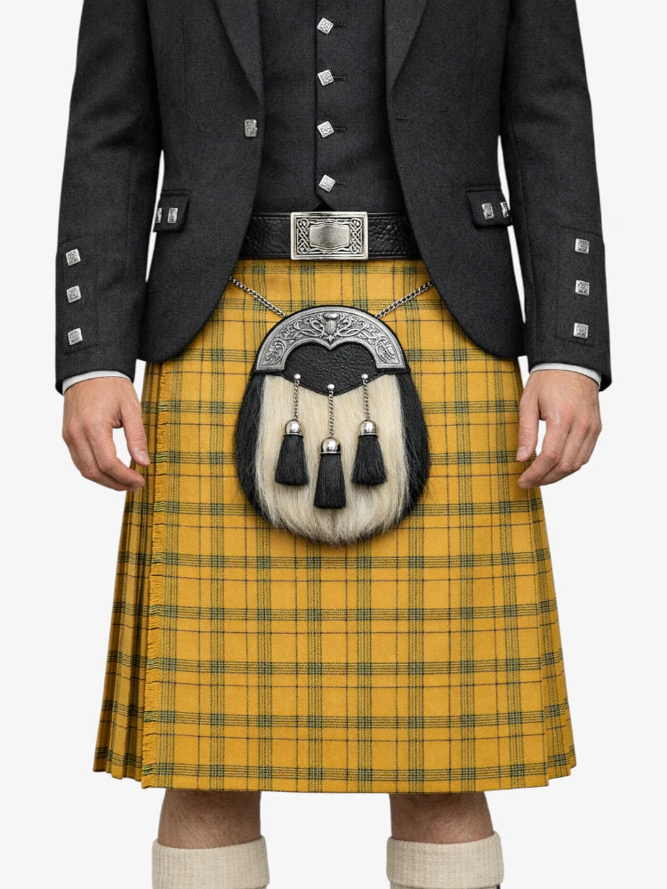 Person wearing a yellow tartan kilt with a dark jacket on a white background