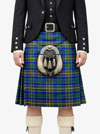 Person wearing a traditional Scottish kilt with a tartan pattern on a white background