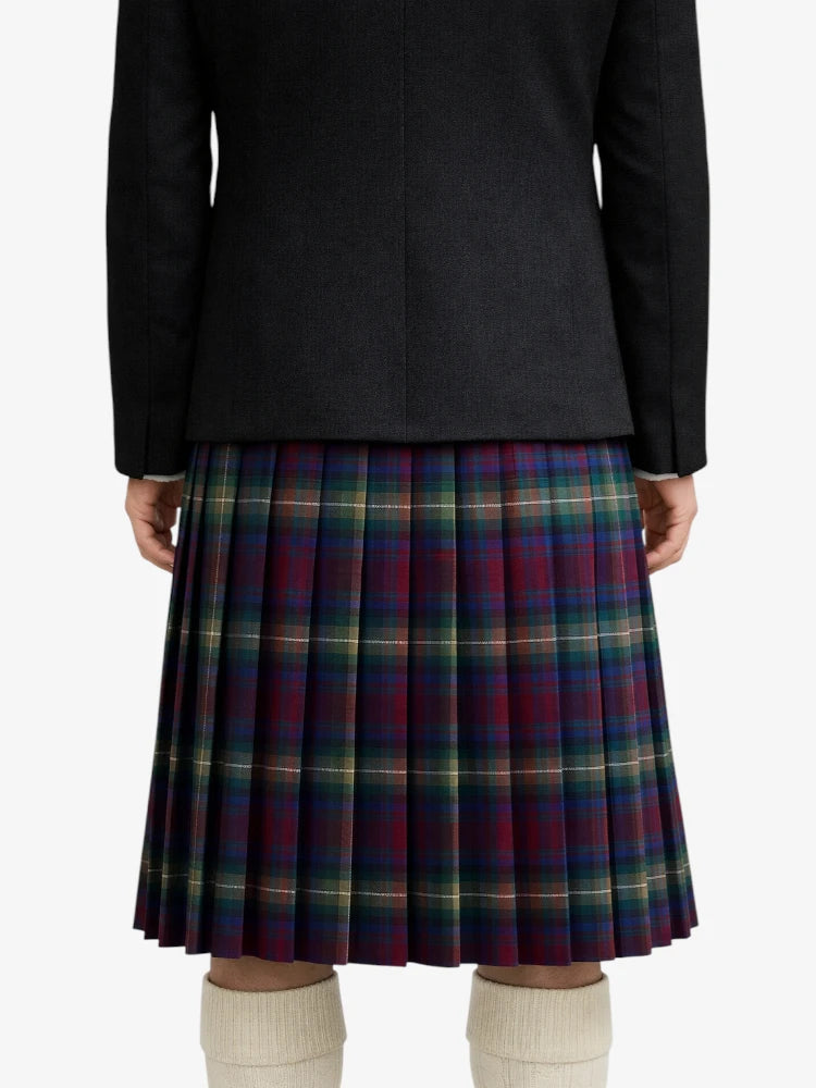 Person wearing a black coat and plaid kilt on a white background