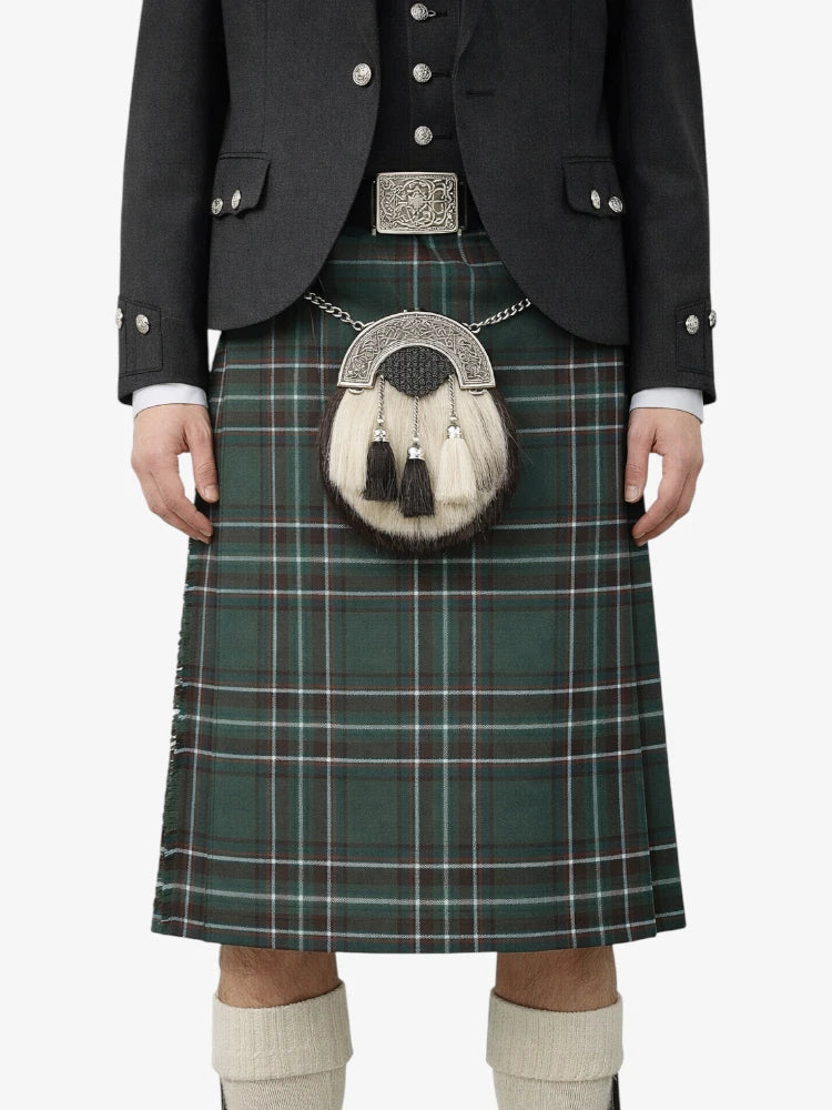 Person wearing a traditional Scottish kilt with a sporran on a white background