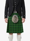 Person wearing a traditional Scottish kilt with a plaid pattern on a white background