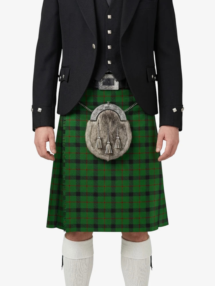 Person wearing a traditional Scottish kilt with a plaid pattern on a white background
