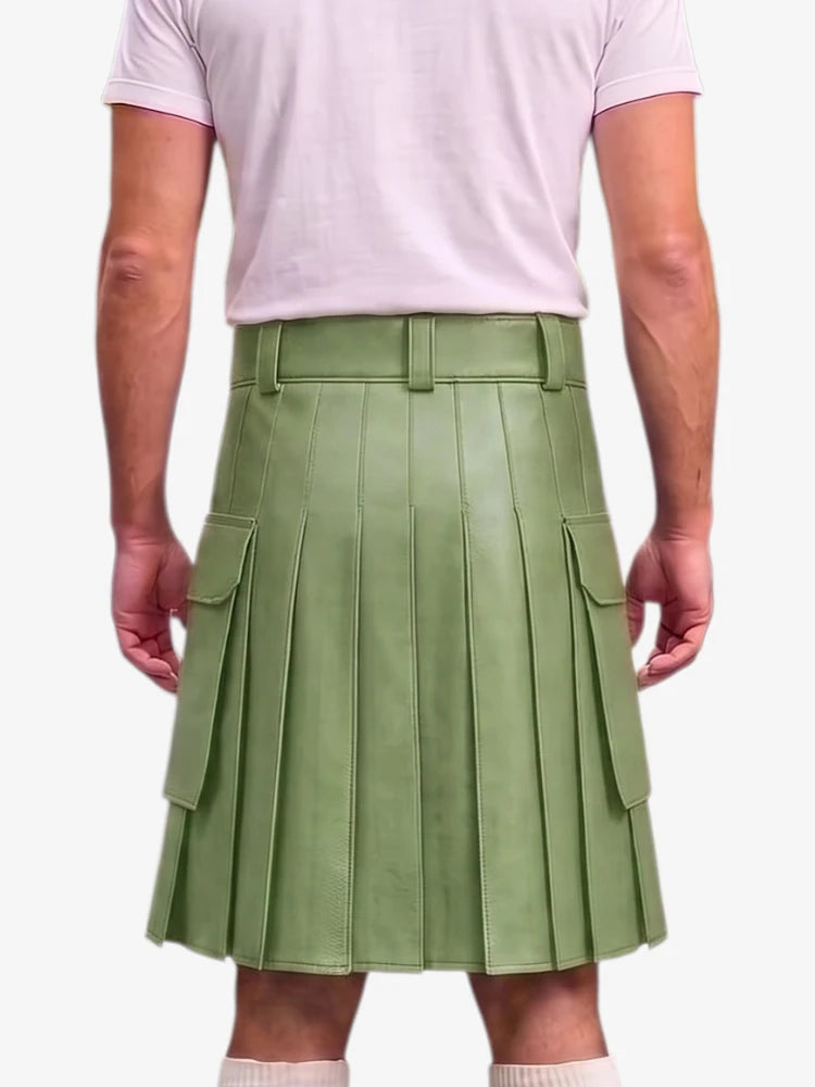 A person shown from the back wearing a light sage green pleated mini skirt with side cargo pockets and a matching belt, paired with a pale pink t-shirt.