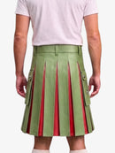 A model shown from the back wearing a green pleated leather kilt with red lining and side flap pockets, paired with a light pink t-shirt.