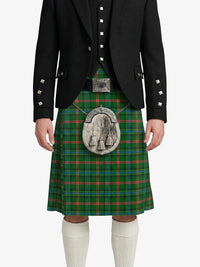 Person wearing a green plaid kilt with a black jacket on a white background