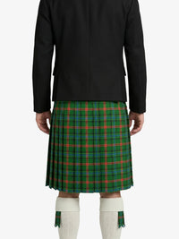 Person wearing a green plaid kilt with a black jacket on a white background