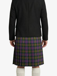 Person wearing a black jacket and a plaid kilt on a white background