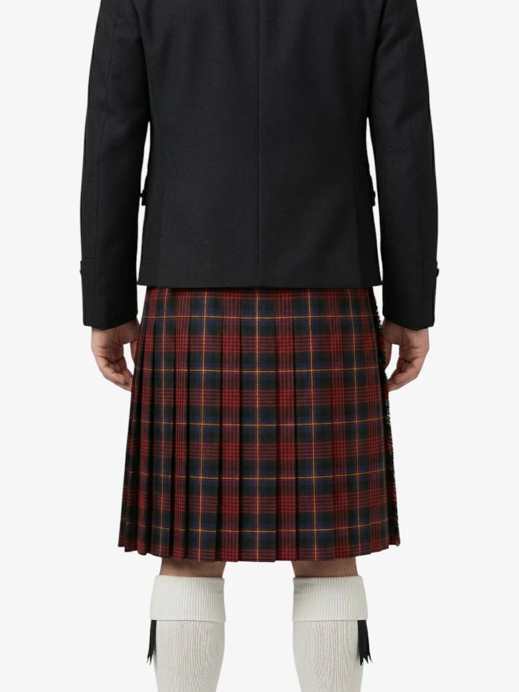 Person wearing a black jacket and red plaid kilt on a white background