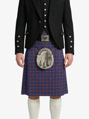 Person wearing a traditional Scottish kilt with a matching jacket on a white background