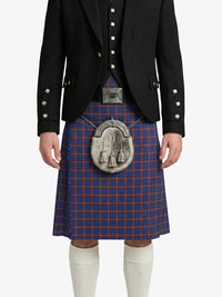 Person wearing a traditional Scottish kilt with a matching jacket on a white background