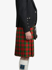 Person wearing a black jacket and red plaid kilt on a white background
