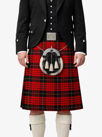 Person wearing a red tartan kilt with a black jacket on a white background