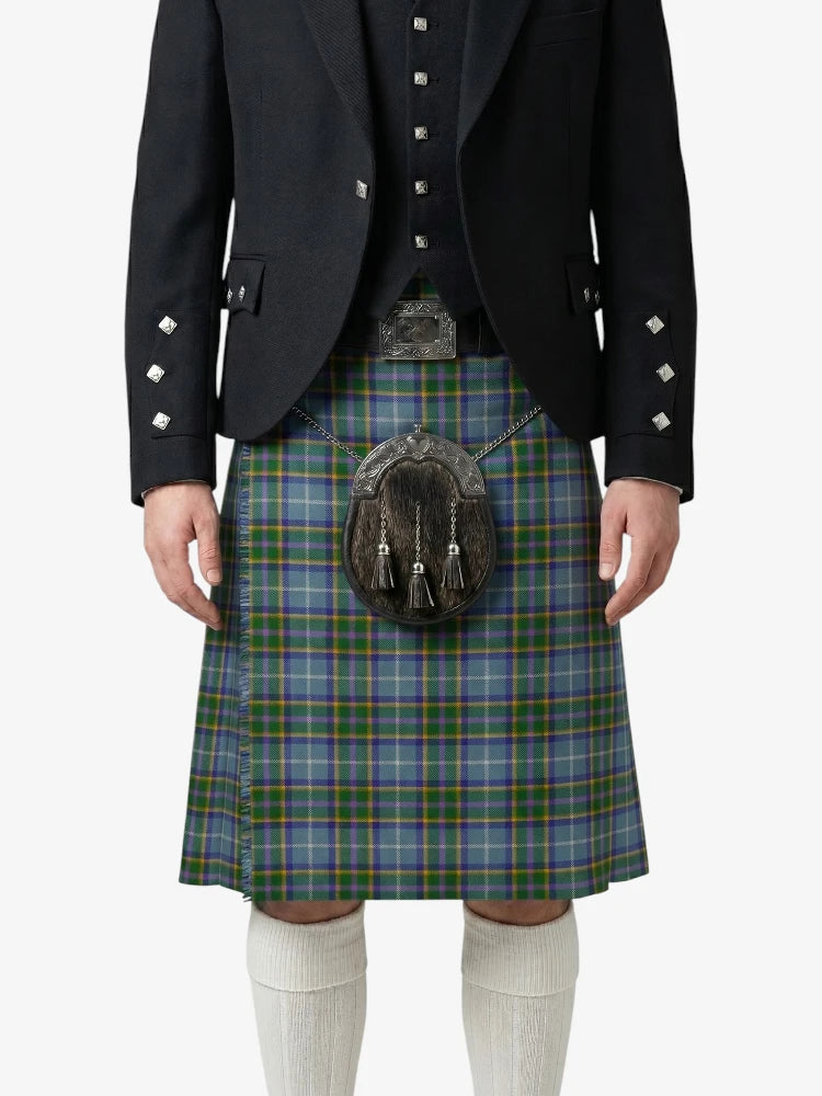 Person wearing a traditional Scottish kilt with a jacket on a white background