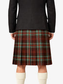 Person wearing a black jacket and red plaid kilt on a white background