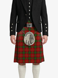 Person wearing a red tartan kilt with a black jacket on a white background